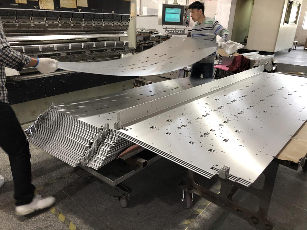 Bending and forming large metal sheet